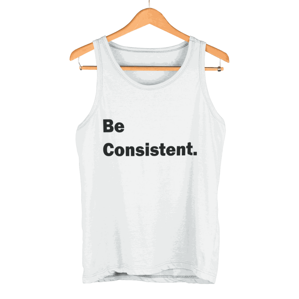 White Be Consistent Tank Top with bold black text hanging on wooden hanger